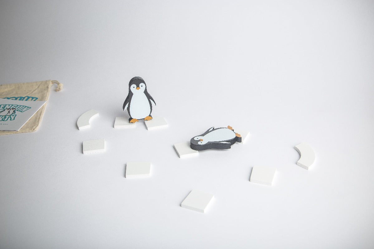 Penguin Party is an original wooden travel game invented by Around The Box